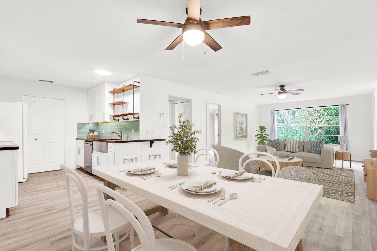 8356 Southeast Croft Circle, Unit O3 Hobe Sound, FL 33455 - Photo 1 of 20 a view of a dining room with furniture window and wooden floor