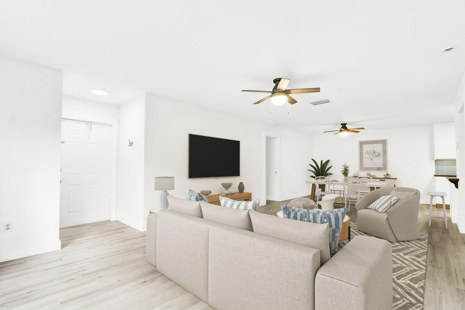8356 Southeast Croft Circle, Unit O3 Hobe Sound, FL 33455 - Photo 2 of 20 a living room with furniture and a flat screen tv