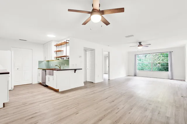 a view of kitchen and kitchen with wooden floor
