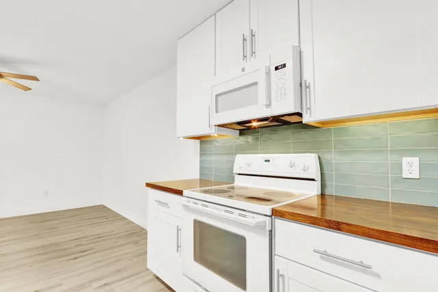 a view of kitchen with wooden floor