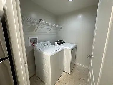 a utility room with dryer and washer