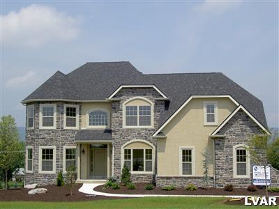 245 East Dell Road, Unit LOT10 Bath, PA 18014 - Photo 1 of 15 a front view of a house with garden
