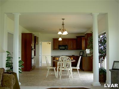 245 East Dell Road, Unit LOT10 Bath, PA 18014 - Photo 4 of 15 a view of a dining room with furniture and chandelier