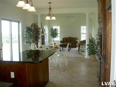 245 East Dell Road, Unit LOT10 Bath, PA 18014 - Photo 5 of 15 a living room with furniture and a chandelier
