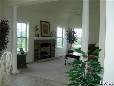 245 East Dell Road, Unit LOT10 Bath, PA 18014 - Photo 10 of 15 a living room with furniture and a fireplace
