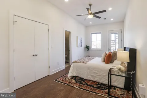 a bedroom with a bed and window