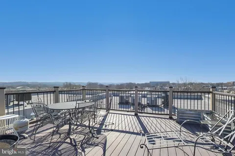 a view of a balcony with wooden floor