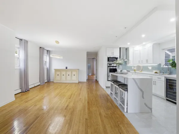 a large kitchen with a large counter top appliances and cabinets