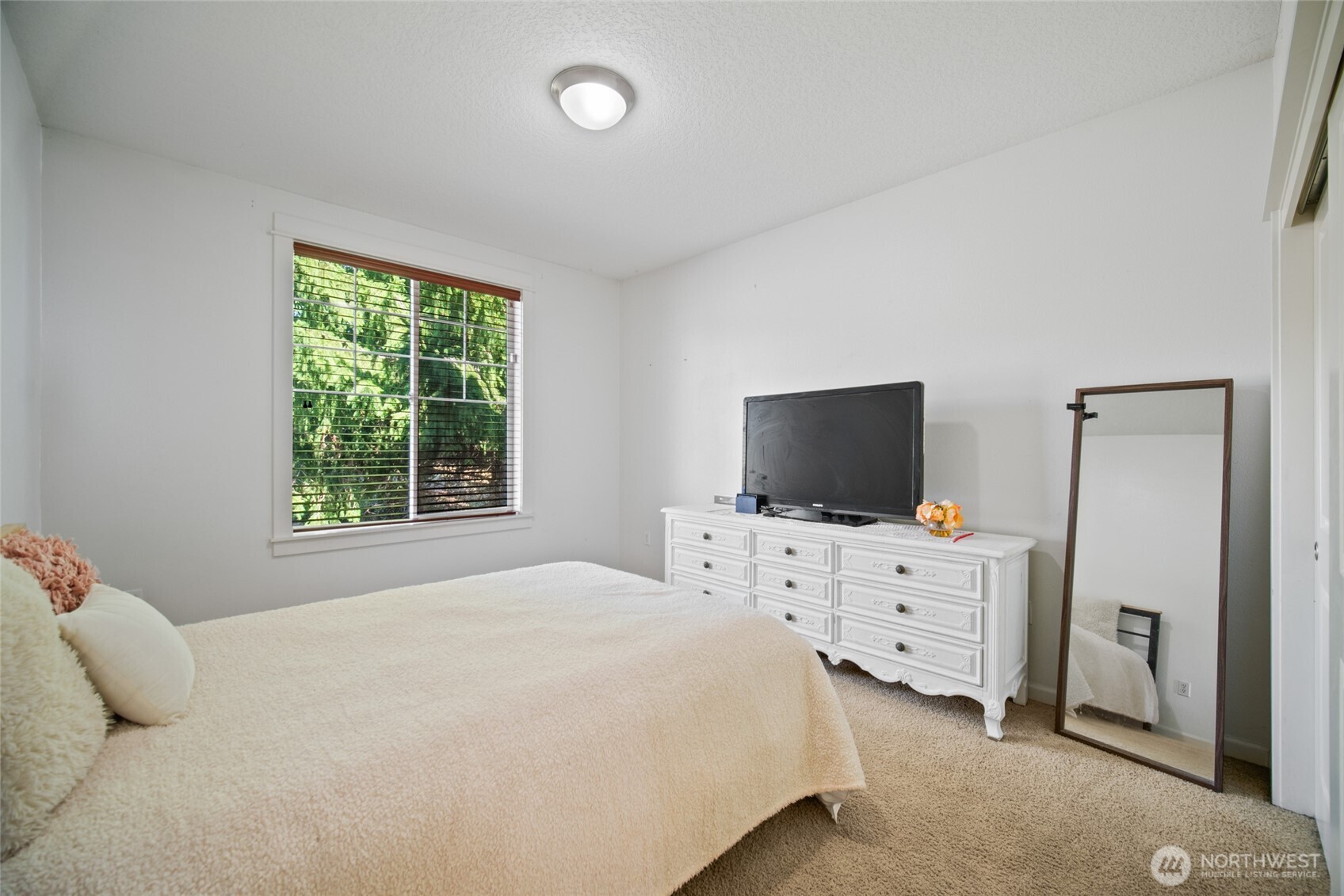 172 Blackjack Drive Kalama, WA 98625 - Photo 18 of 40 a bedroom with a bed and flat screen tv