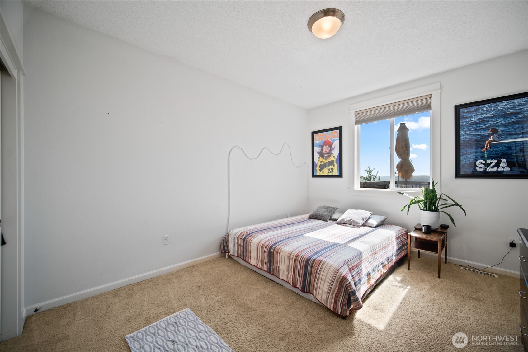 172 Blackjack Drive Kalama, WA 98625 - Photo 20 of 40 a bedroom with a bed and painting on the wall