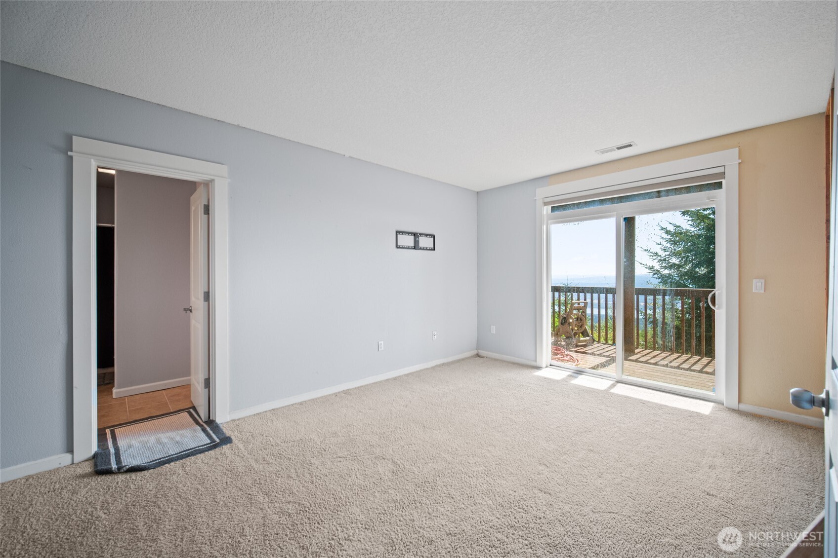 172 Blackjack Drive Kalama, WA 98625 - Photo 29 of 40 a view of an empty room with a sliding door