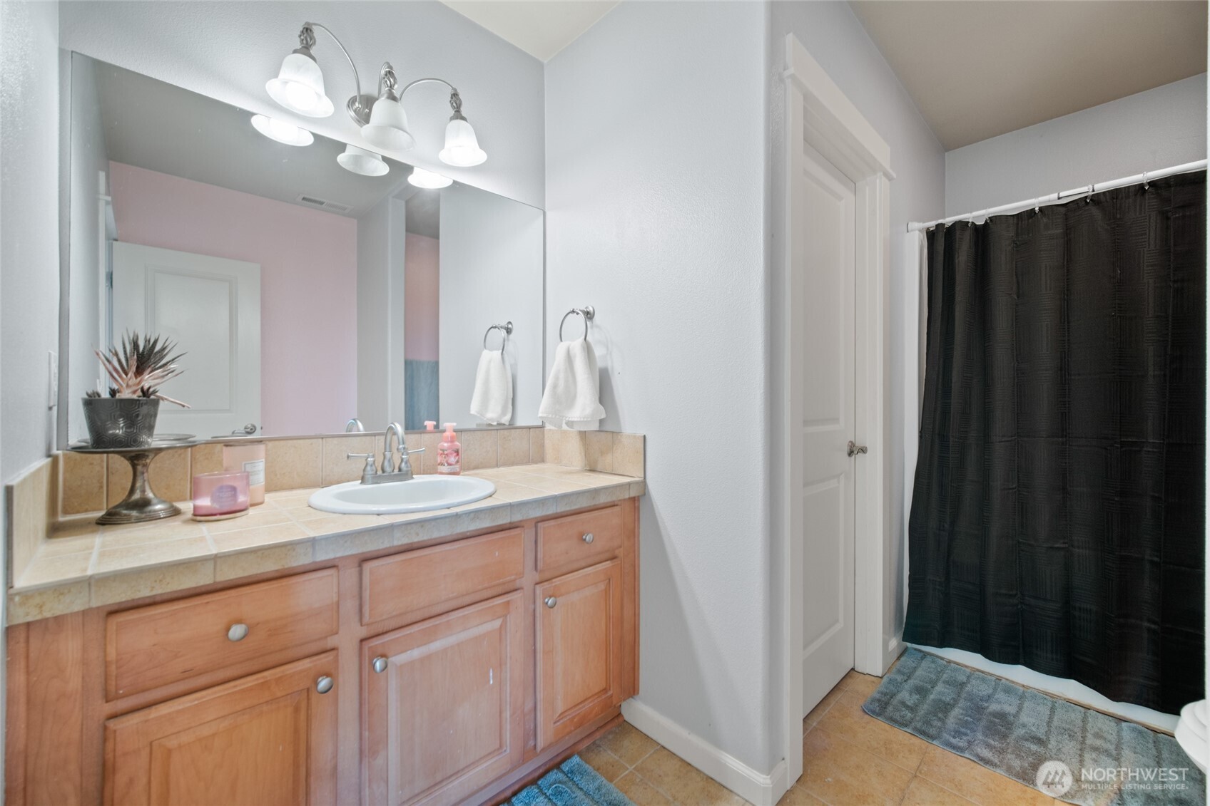 172 Blackjack Drive Kalama, WA 98625 - Photo 30 of 40 a en suite bathroom with a granite countertop sink and a mirror