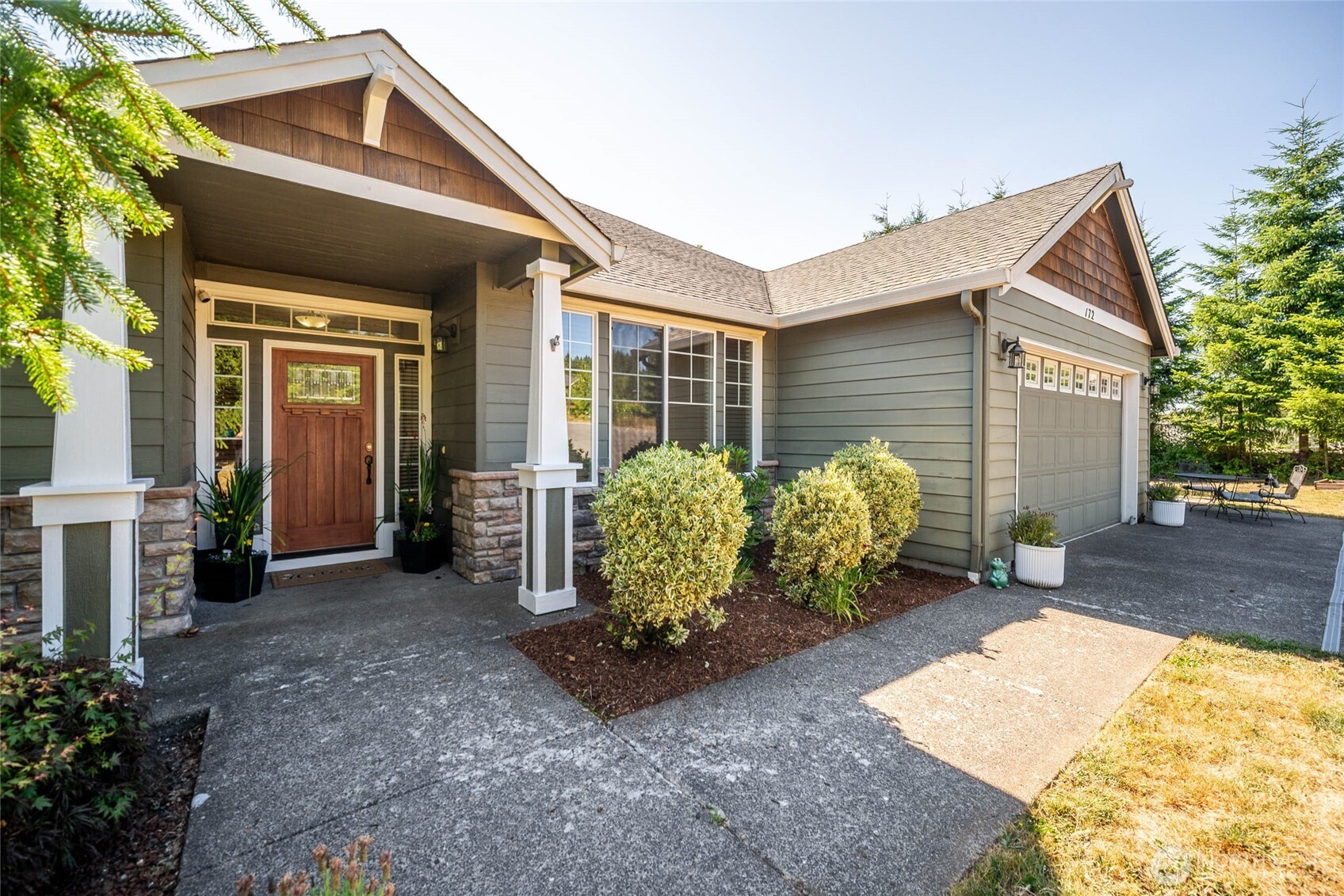 172 Blackjack Drive Kalama, WA 98625 - Photo 3 of 40 a front view of a house with garden
