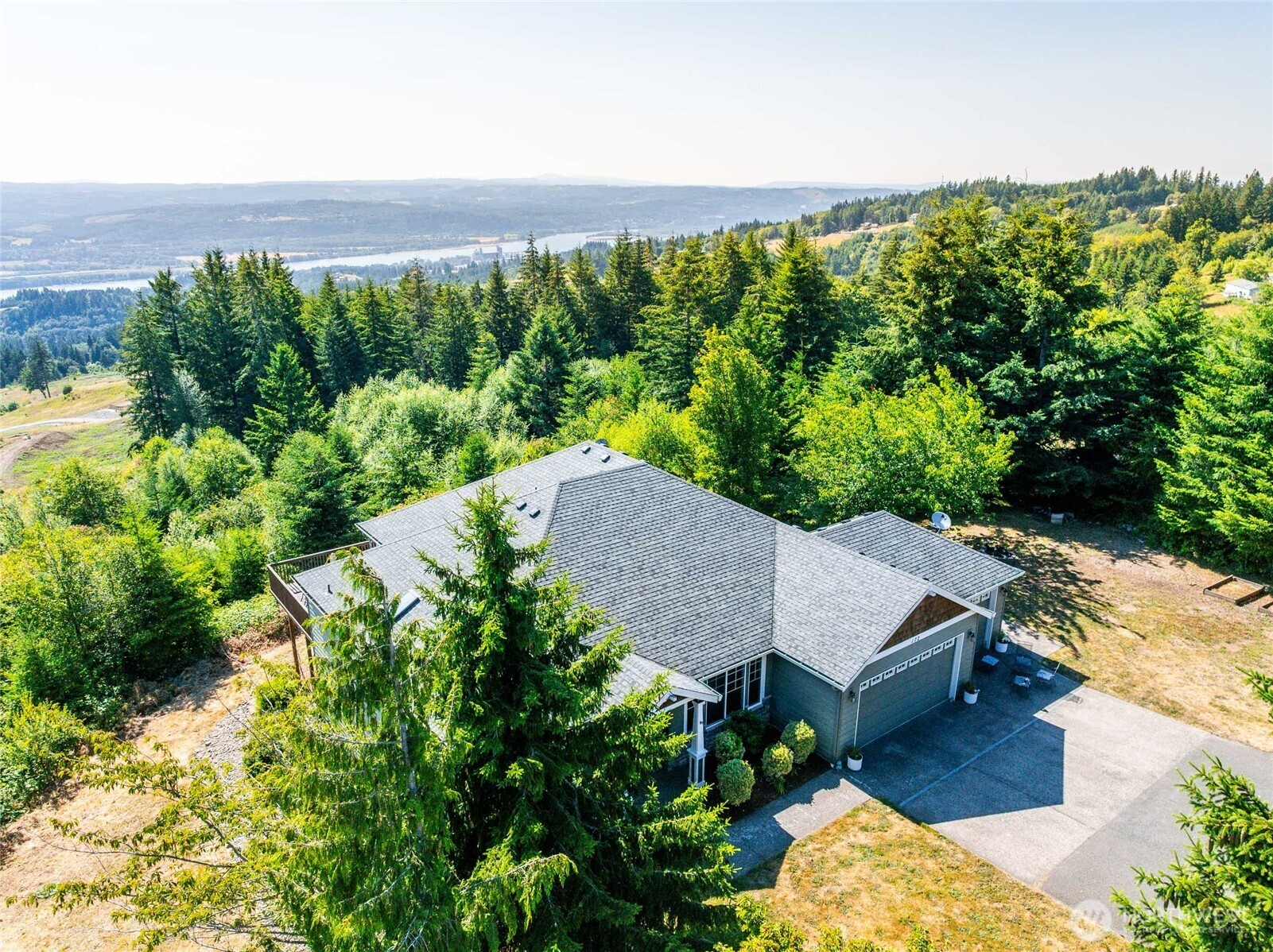172 Blackjack Drive Kalama, WA 98625 - Photo 35 of 40 a aerial view of a house with balcony and trees all around