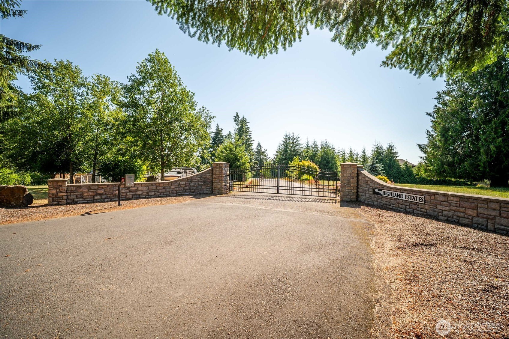 172 Blackjack Drive Kalama, WA 98625 - Photo 40 of 40 a view of a road with a bench and trees around