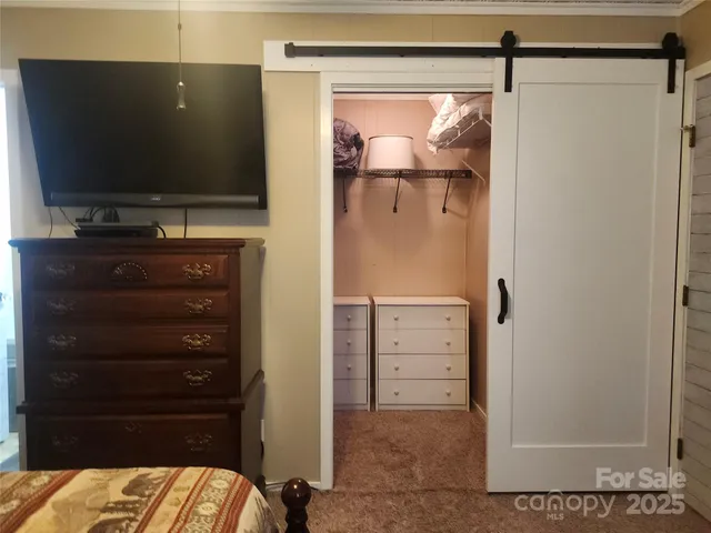 a bathroom with a toilet and shower