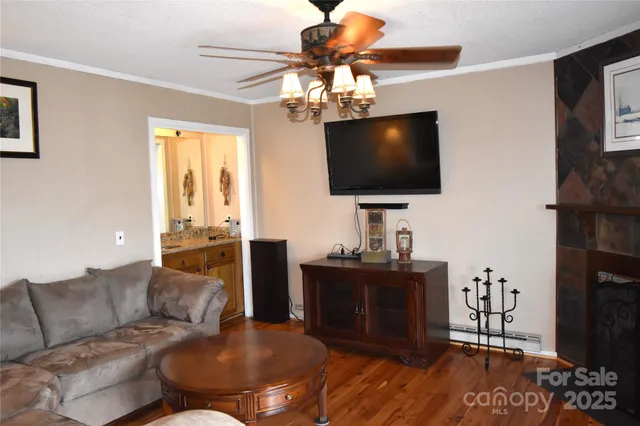 a living room with furniture and a flat screen tv