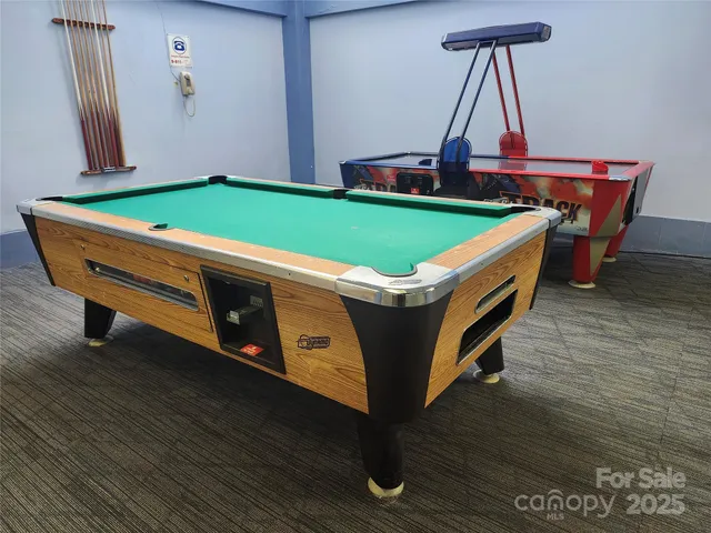 a vase of flowers sitting on a floor