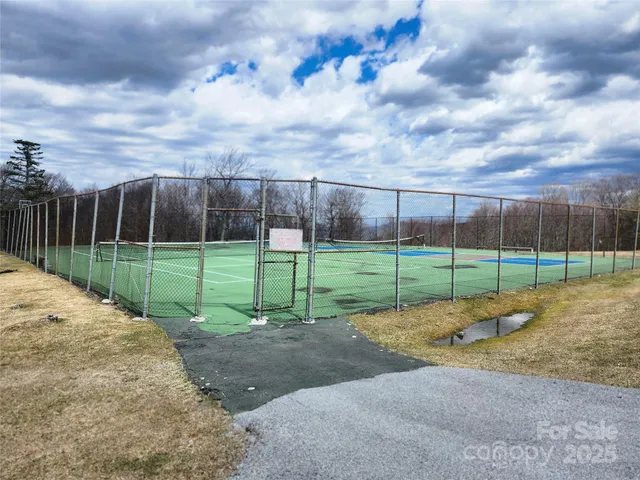 a view of a swimming pool with an outdoor space and seating area