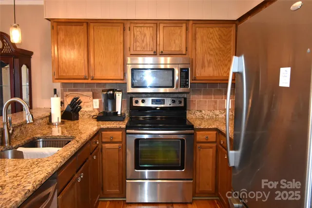 a kitchen with a stove and a microwave