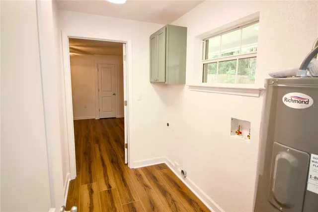 a view of hallway with wooden floor