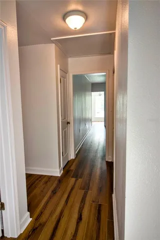 a bathroom with a sink and mirror with toilet