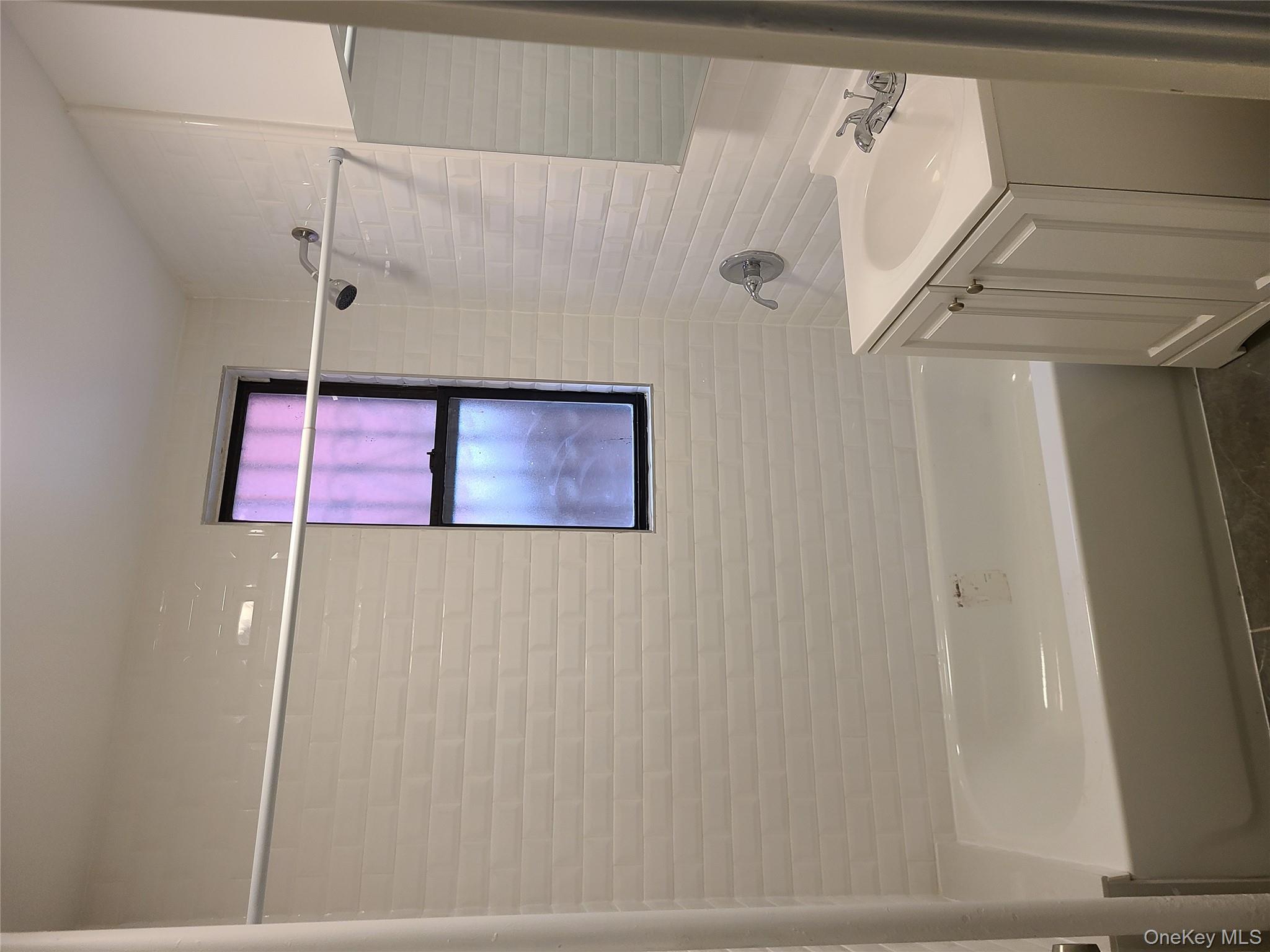 1309 Seneca Avenue Bronx, NY 10474 - Photo 6 of 20 a bathroom with a shower and a bath tub