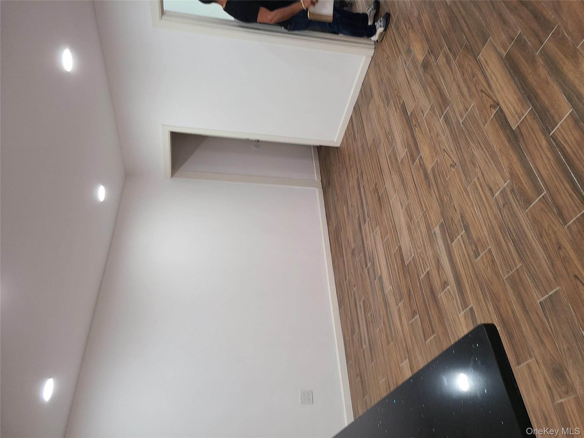 1309 Seneca Avenue Bronx, NY 10474 - Photo 9 of 20 a view of room and wooden floor