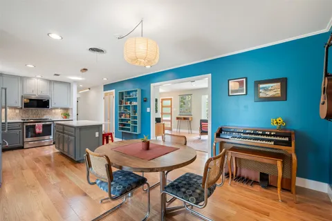 a kitchen with a table and chairs in it