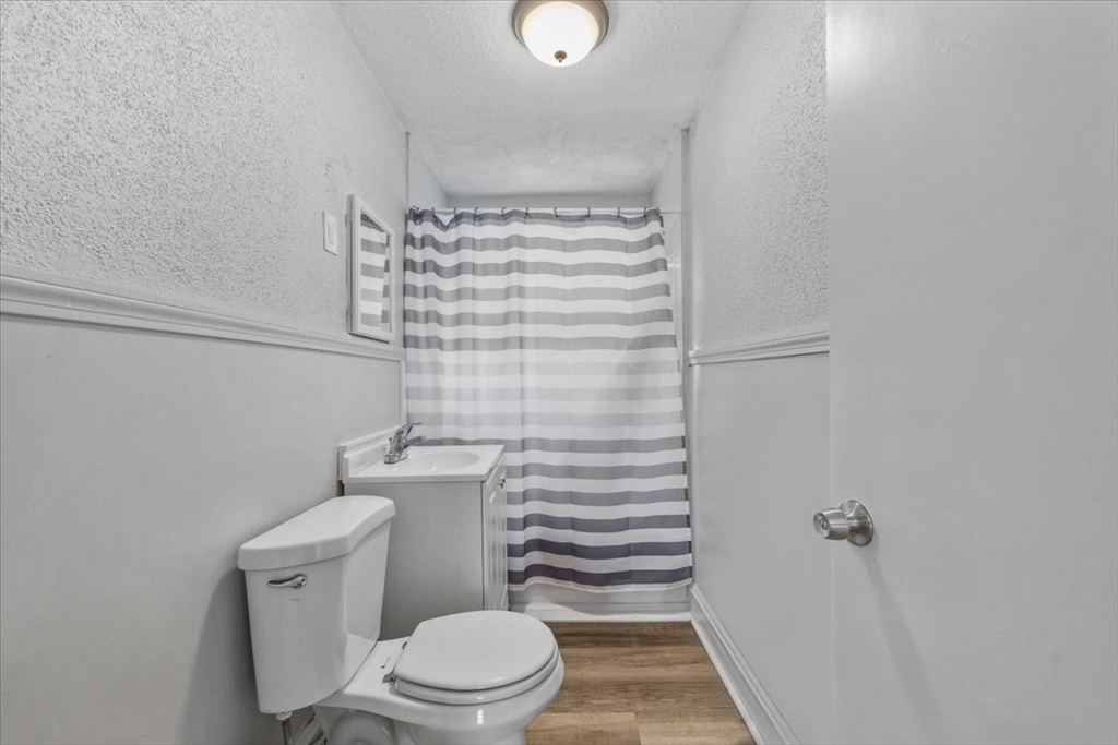 225 Mulberry Street Fall River, MA 02721 - Photo 8 of 13 a bathroom with a toilet and a shower