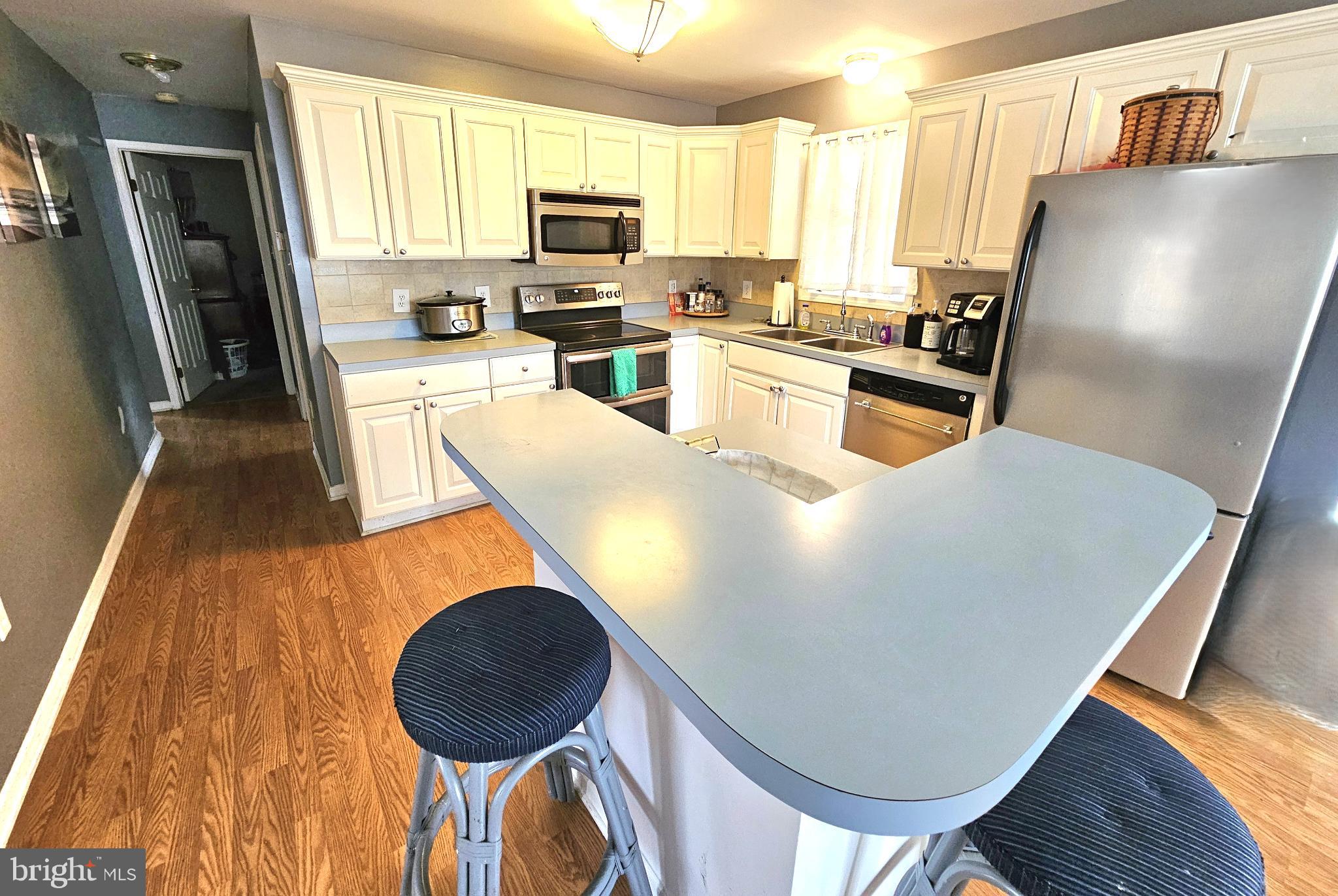 103 State Street Elkton, MD 21921 - Photo 6 of 20 Bright and inviting kitchen space with island.