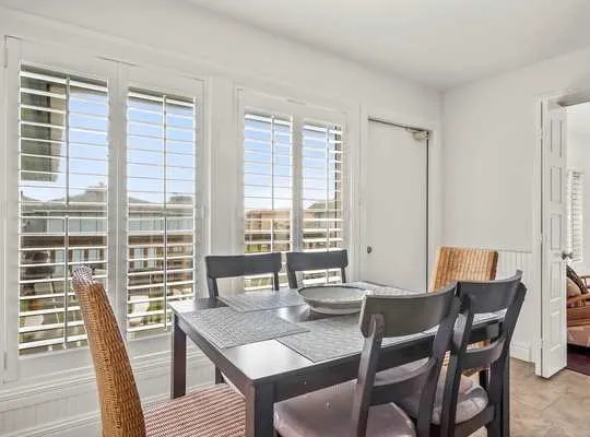 a view of a dining room with furniture window and outside view