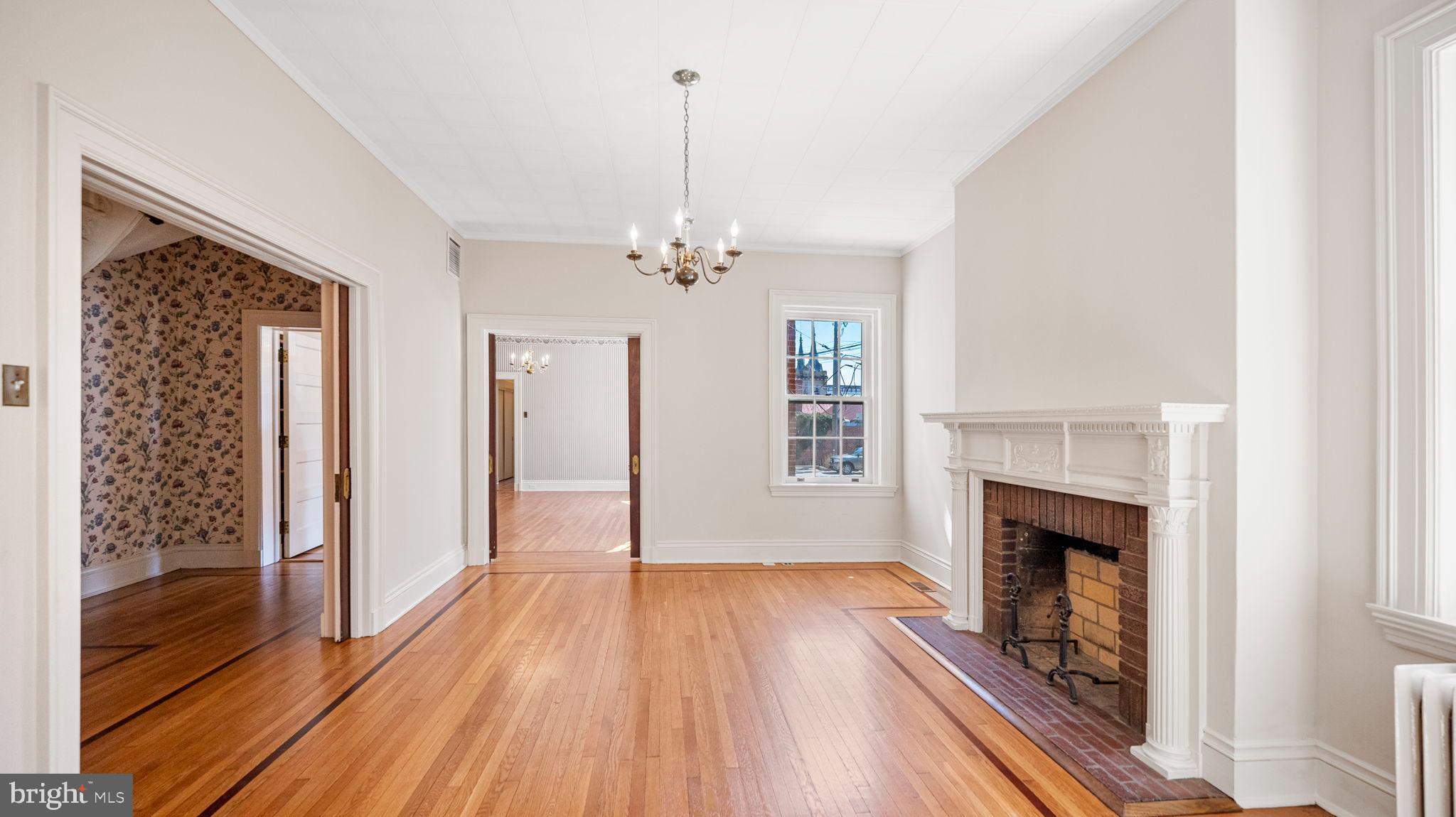 110 North Court Street Frederick, MD 21701 - Photo 14 of 28 a view of a livingroom with wooden floor and a fireplace
