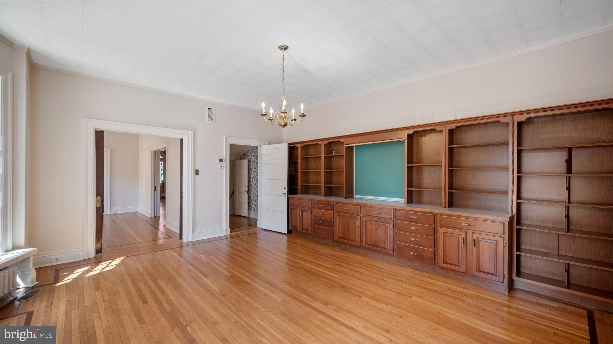 110 North Court Street Frederick, MD 21701 - Photo 17 of 28 wooden floor in an empty room with a window
