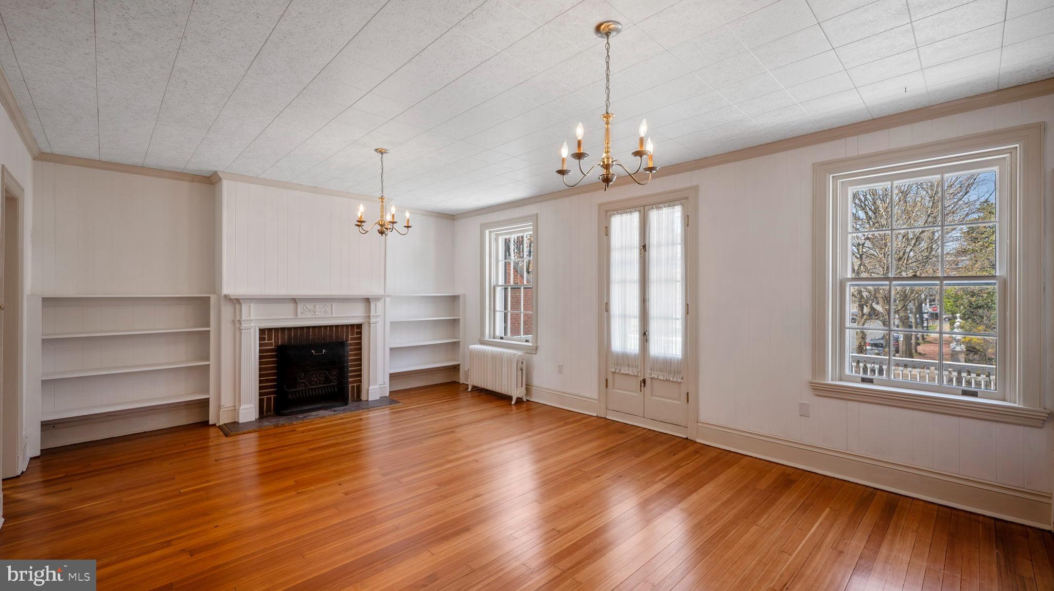 110 North Court Street Frederick, MD 21701 - Photo 20 of 28 a view of an empty room with a window and fireplace