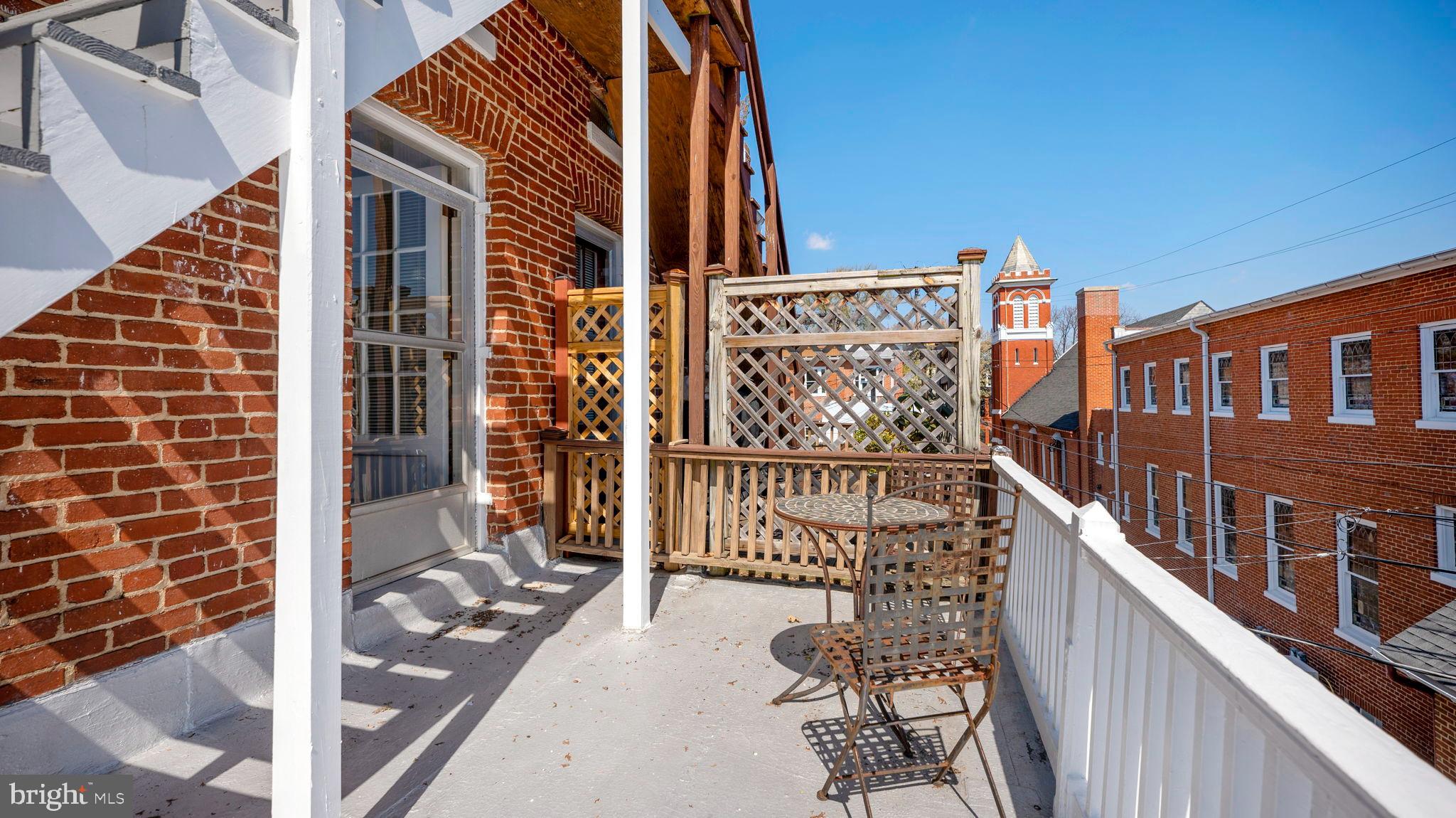 110 North Court Street Frederick, MD 21701 - Photo 24 of 28 a view of balcony with wooden wall and potted plants