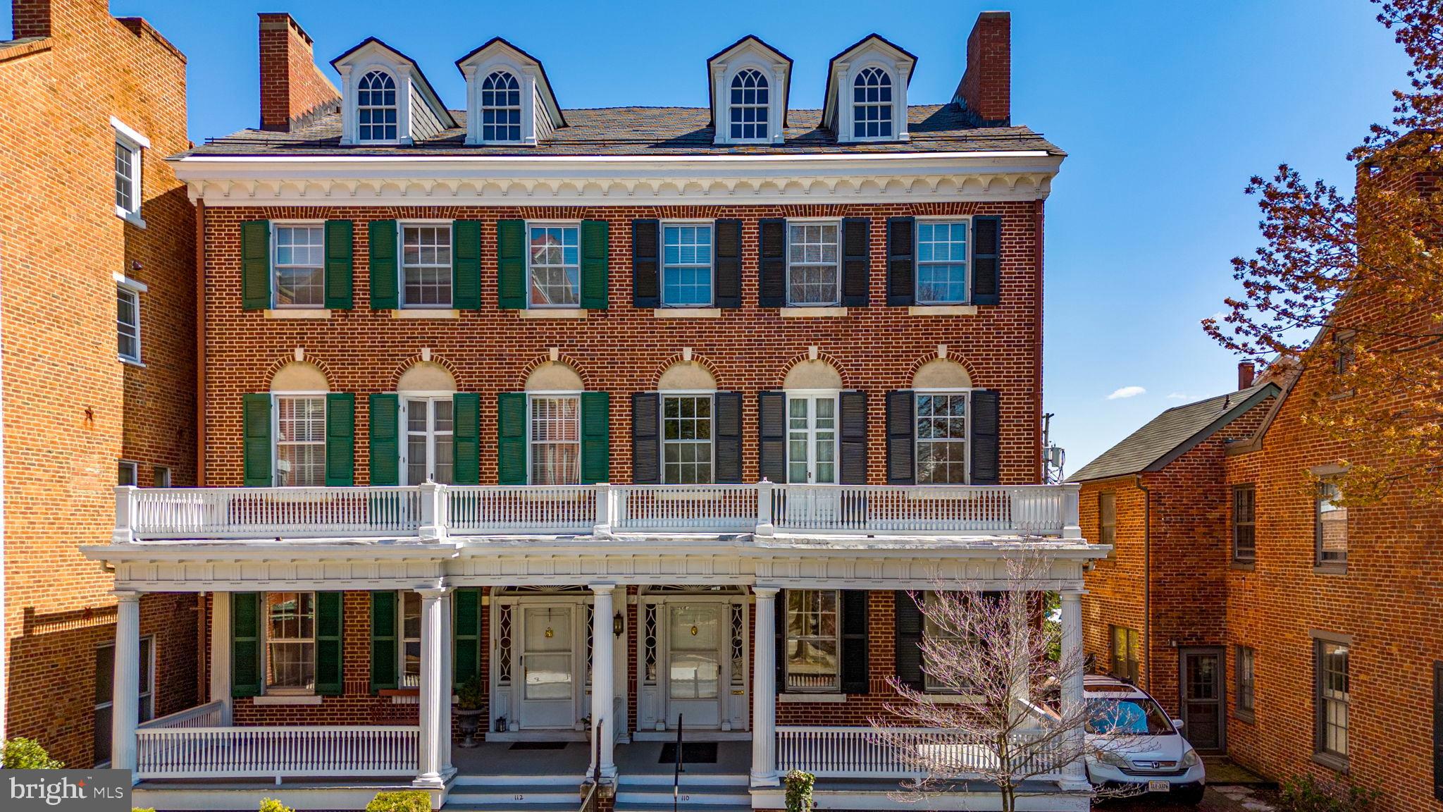 110 North Court Street Frederick, MD 21701 - Photo 3 of 28 a view of a brick house with many windows