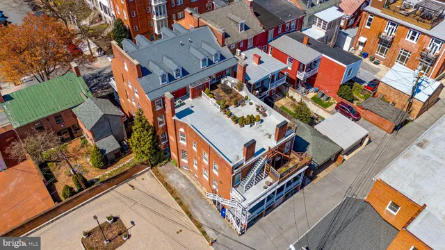 an aerial view of houses with outdoor space