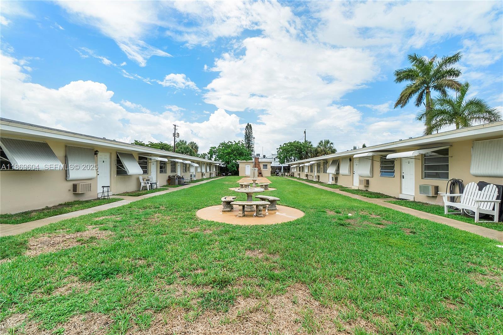 2901 Polk Street, Unit 14 Hollywood, FL 33020 - Photo 16 of 16 a view of a house with backyard and sitting area