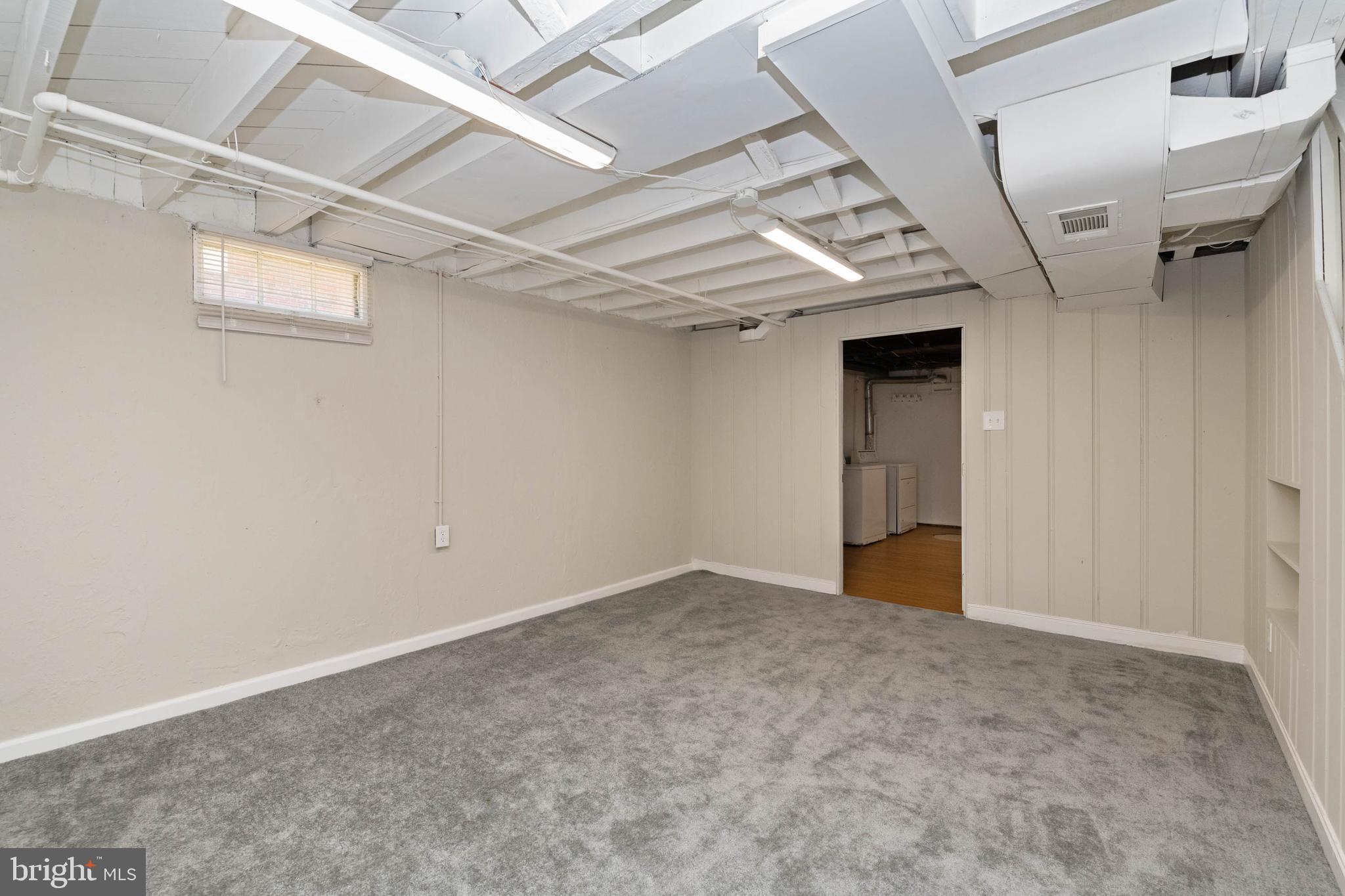 3718 Bartwood Road Baltimore, MD 21215 - Photo 20 of 27 Family room with new carpet