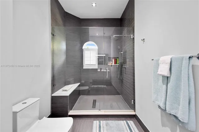 a view of an empty room with windows