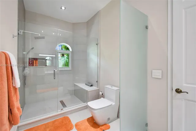 a open kitchen with stainless steel appliances granite countertop a stove a sink and a microwave