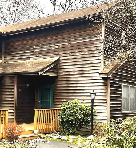 a view of a house with a yard and garage