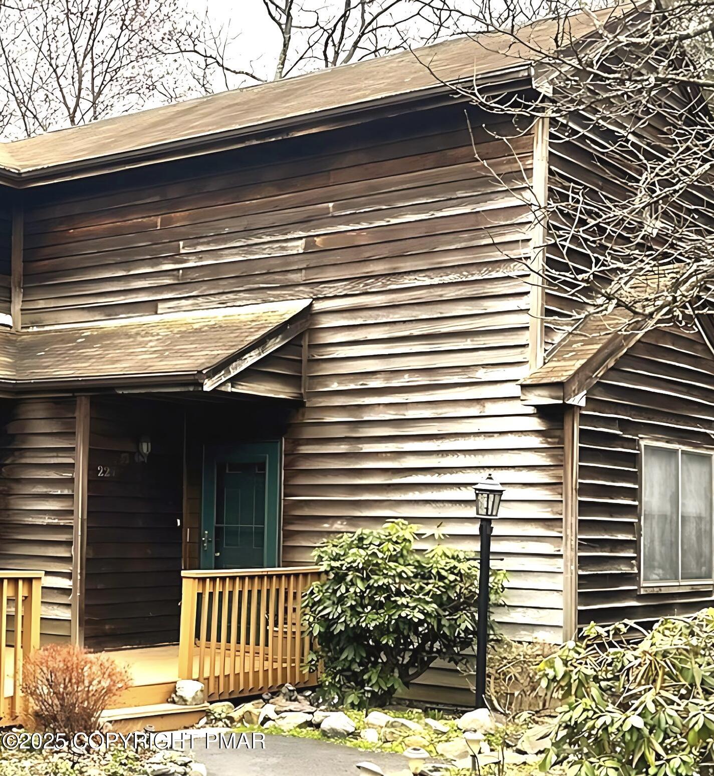 a view of a house with a yard and garage