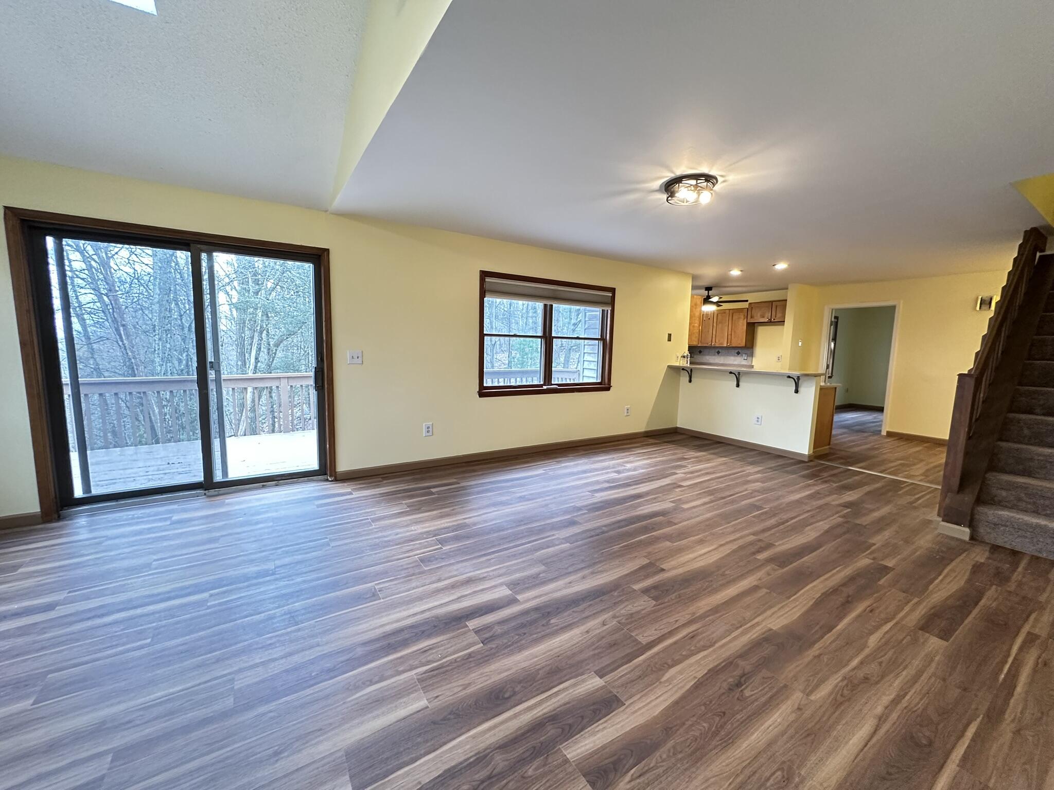 227 Image Drive Scotrun, PA 18355 - Photo 19 of 37 an empty room with wooden floor and windows