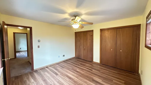 a view of a livingroom with a chandelier fan
