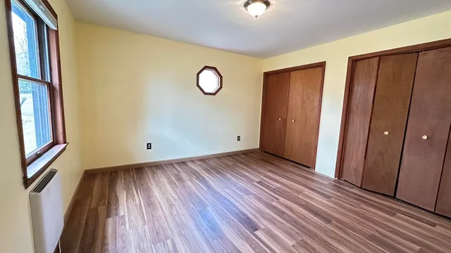 a view of a livingroom with wooden floor