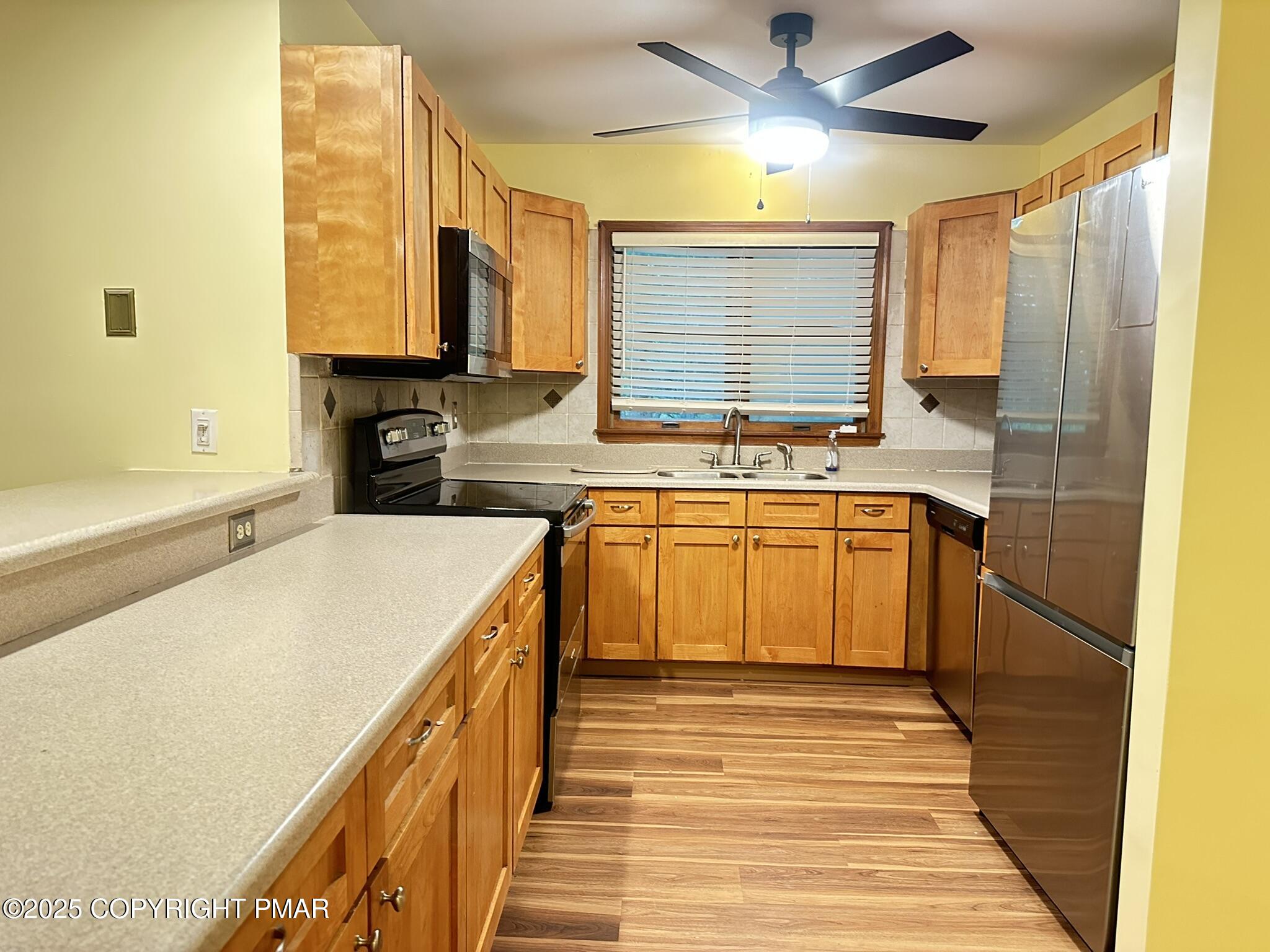 227 Image Drive Scotrun, PA 18355 - Photo 8 of 37 a kitchen with a sink and cabinets