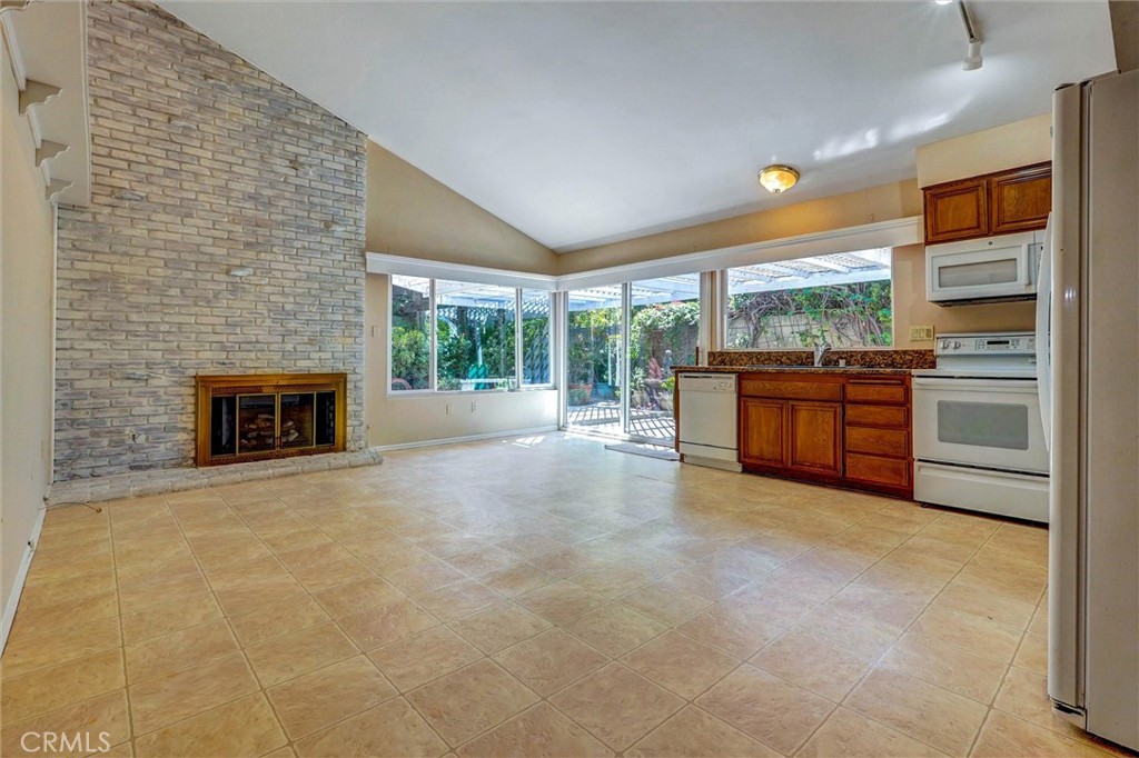 11500 Yolanda Avenue Porter Ranch, CA 91326 - Photo 4 of 29 Kitchen/Family room with fireplace