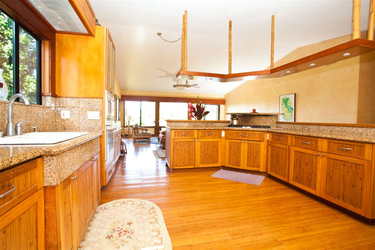 455 Ulumalu Road Haiku, HI 96708 - Photo 9 of 19 a large white kitchen with a large window